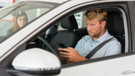 blonde man sitting behind the wheel completing quote request generated with Z-image