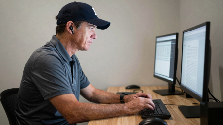 insurance agent sitting at computer