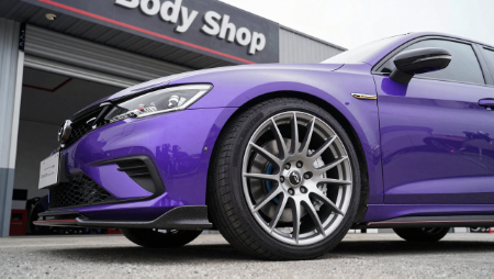 low angle shot of purple car with performance rims and tires generated with Z-Image