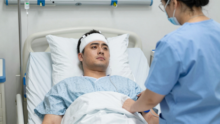 man with bandaged head attended by nurse generated with Z-Image